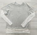 Camiseta oversize algodón con manga de blonda y bajo con blonda