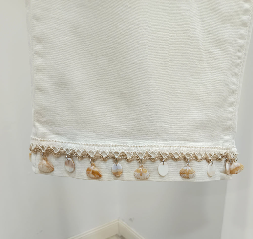 Jeans adorno conchas