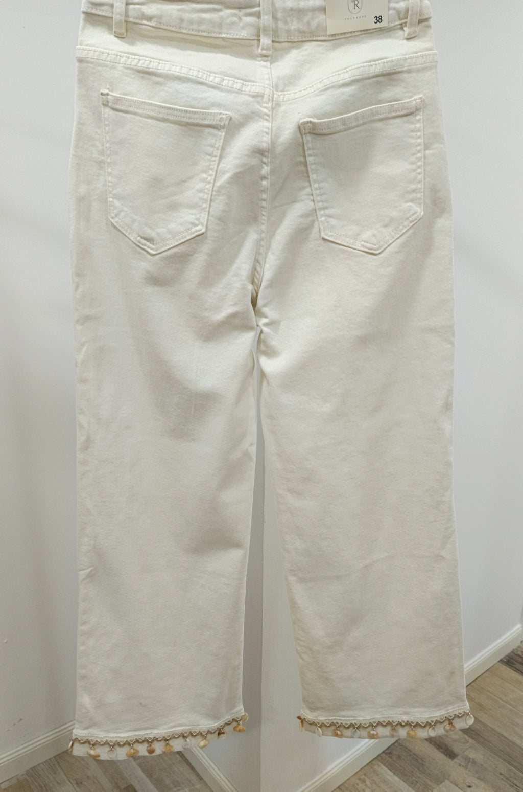 Jeans adorno conchas