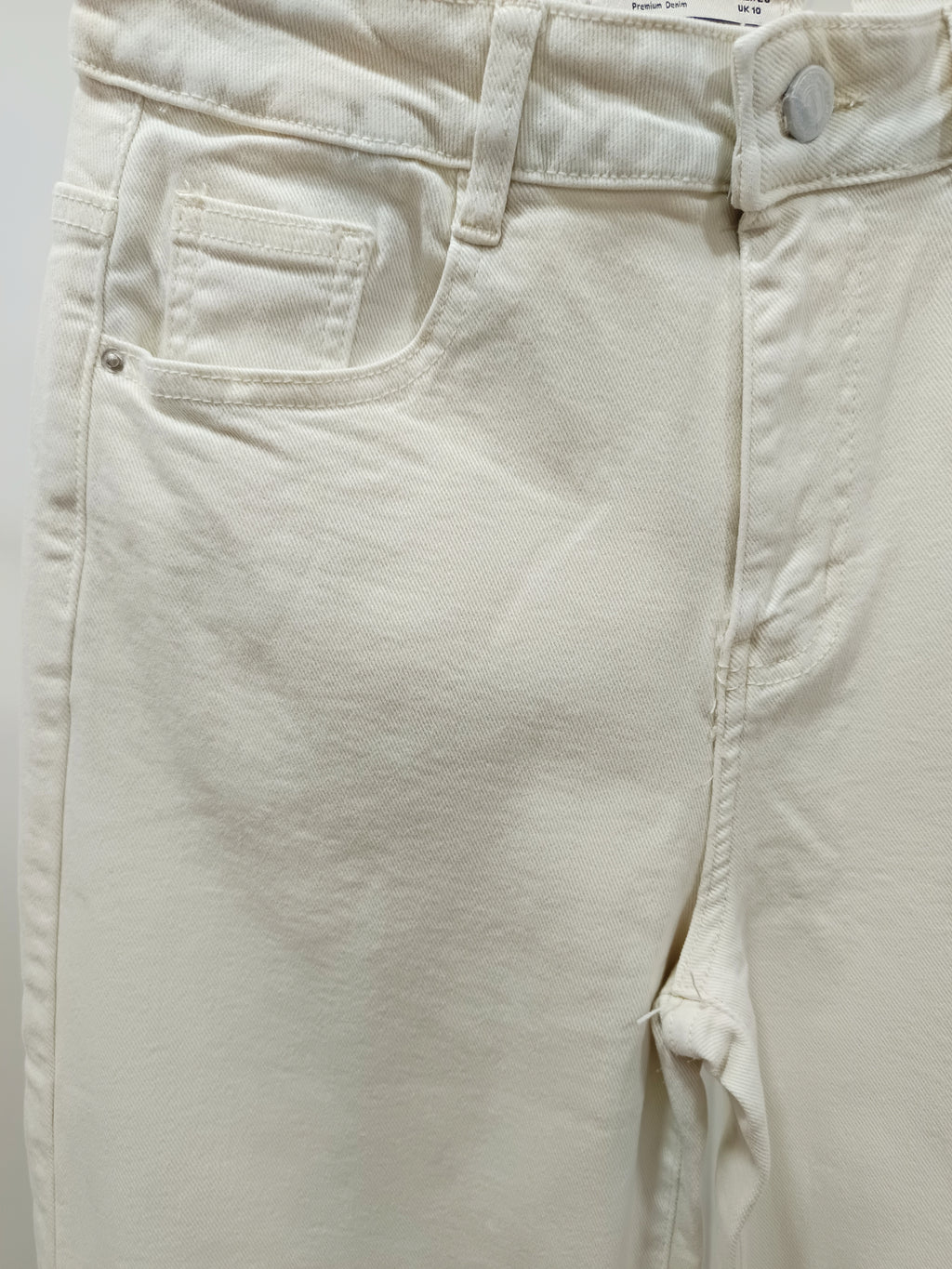 Jeans adorno conchas