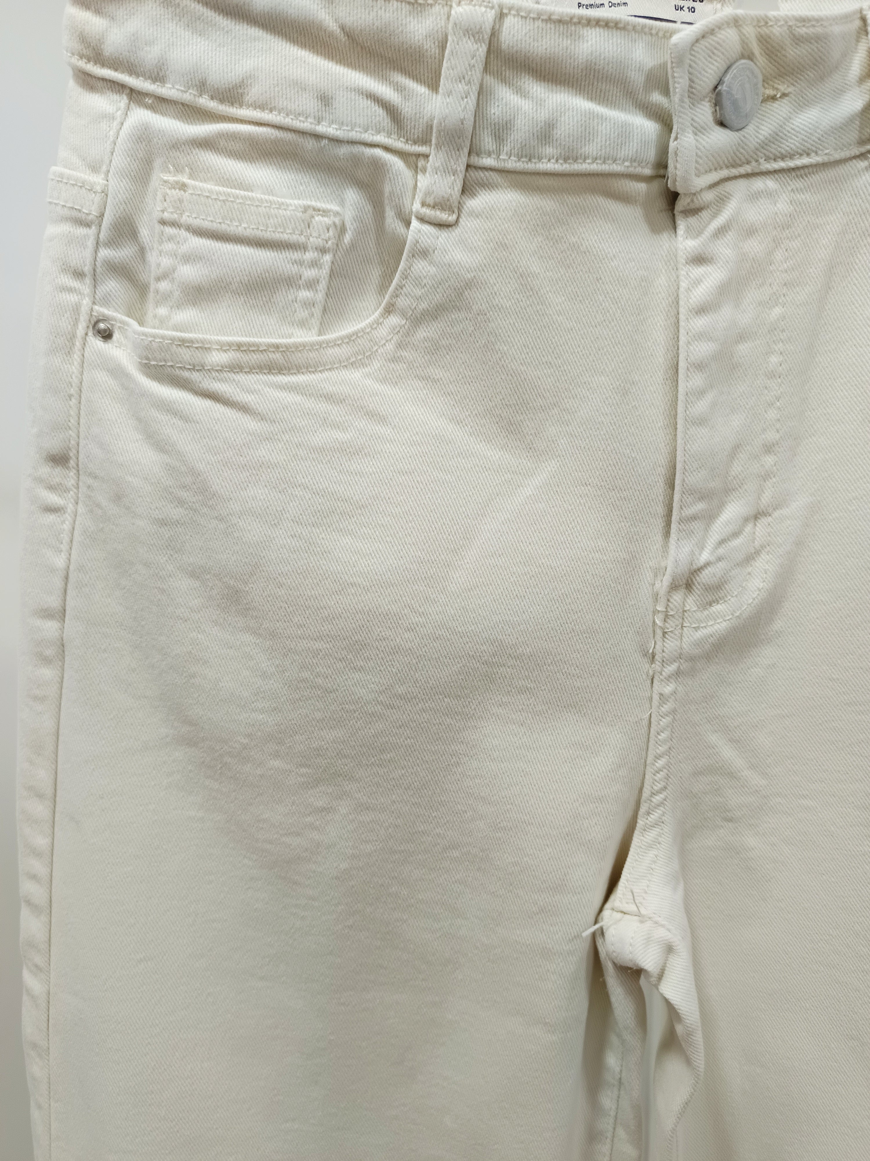 Jeans adorno conchas